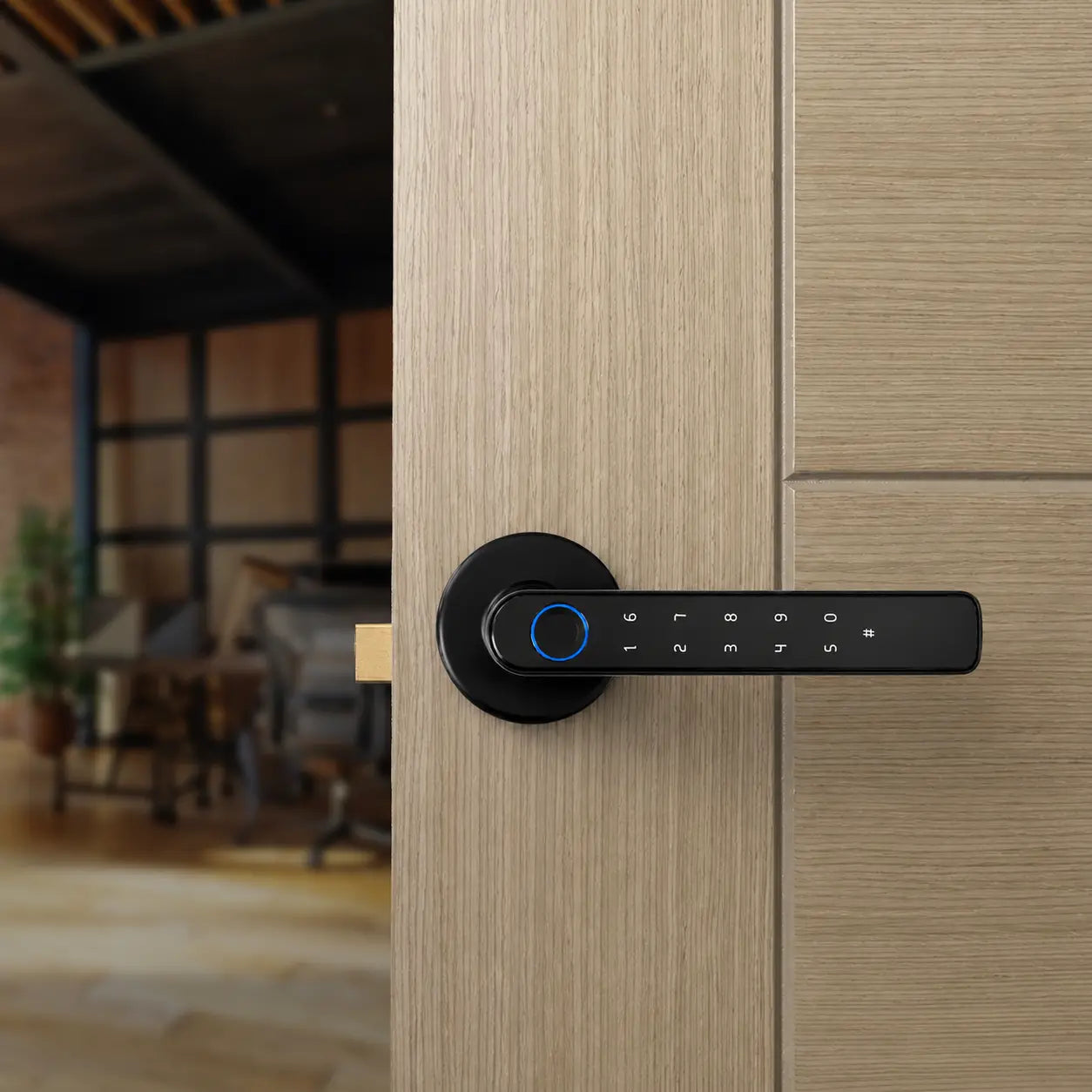 A modern black digital smart door lock with a horizontal handle and blue fingerprint感应 ring, mounted on a light wood paneled door with a blurred interior room in the background.