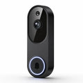 A modern black smart video doorbell with a glossy finish, featuring a central camera lens, a small sensor above it, and a large circular button at the bottom with a glowing blue ring around a black bell icon.