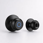 Two black smart doorbell cameras shown on a light gray background, one facing forward with a glowing blue circular ring and the other showing the back side.